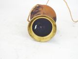 a close up of a gold and blue object on a white surface