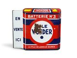 a small tin box with a label on it