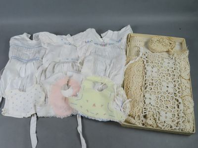 three pieces of clothing in a box on a table