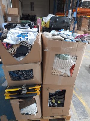 boxes stacked on top of each other on a pallet in a warehouse