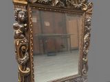 a mirror that is sitting on the floor in front of a wall