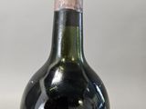a bottle of wine that is sitting on a table