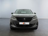 the front view of a grey car in a white room