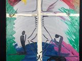 une photo d'un tableau représentant une personne sur une croix