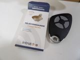 a remote control that is sitting on a table