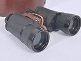 two binoculars sitting next to each other on a white surface