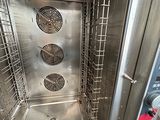 an image of a stainless steel oven with the door open