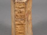 an old book that is sitting on a table