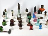 many different types of glass vases on the table