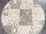 une photo d'un tapis rond posé sur un parquet