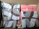a box with a lot of clothes inside of it