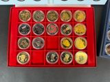 a red box with a lot of coins in it