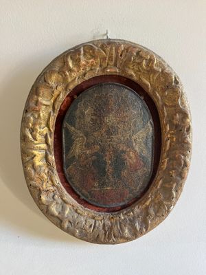 a picture of a picture of a picture of jesus in a gold frame