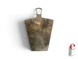 a large metal object hanging on the wall
