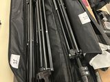 a lot of tripods that are sitting on a table