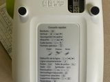 a close up of a white electronic device on a table