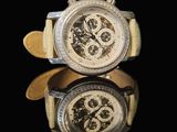 pair of two watches on a reflective surface with a black background