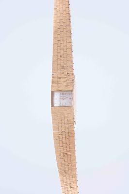 a clock that is on the side of a tall tower