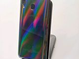 a close up of the back of a phone on a stand