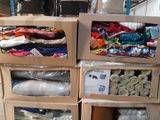 several boxes of clothing are stacked on top of each other