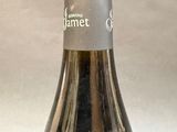 a bottle of wine that is sitting on a table