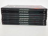 five star wars books stacked on top of each other on a table