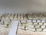 many figurines of soldiers on a table