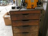a cabinet that has a machine on top of it