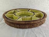 a wicker tray with a divided section of food