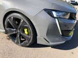 a close up of the front of a car with yellow rims