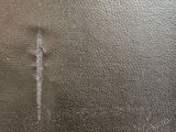 a close up of a metal plate with a cross on it