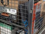 a large metal cage with a bunch of boxes in it