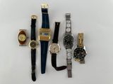 a lot of watches that are sitting on a table