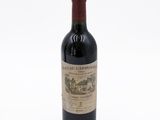 a bottle of wine that is sitting on a table