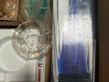 a box full of toothbrushes and other items in it