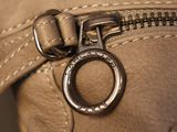 a close up of a purse with a zipper on it