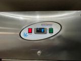 an image of a stainless steel dishwasher with a digital timer