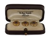 two pairs of cuff watches are in a case on a white surface