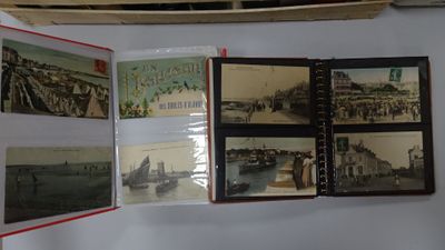 many pictures of boats on display on the wall