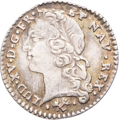 une pièce d'argent portant une tête de femme