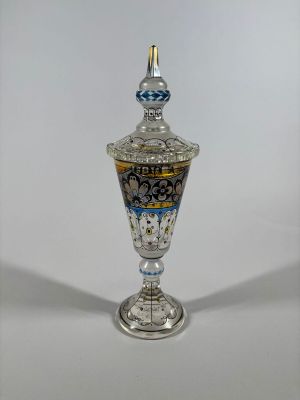 an image of a silver vase with a blue and white design on it