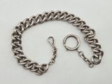 a close up of a chain bracelet with a ring on it