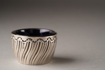 a black and white cup sitting on a table