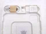 a white box with a charger and a cord attached to it