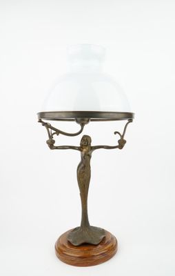 an image of a lamp with a glass shade on top of it