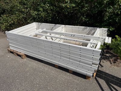 a large white box sitting on a pallet in the street