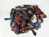 a pile of ties on a white surface