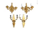 three gold sconces on a white background with a white background