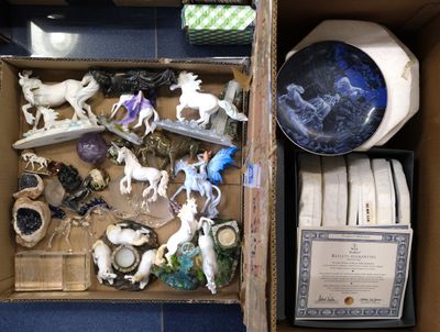 a box full of assorted figurines in it