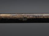 a close up of a baseball bat on a black surface